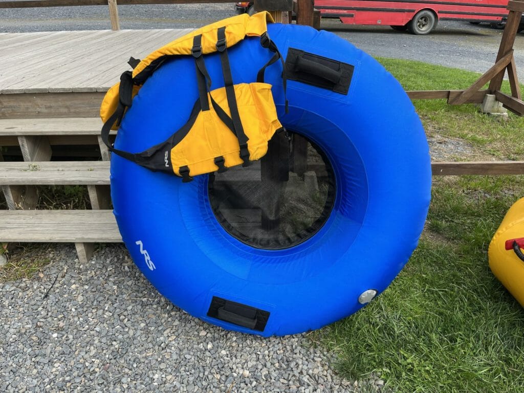 blue rive tube with yellow PFD