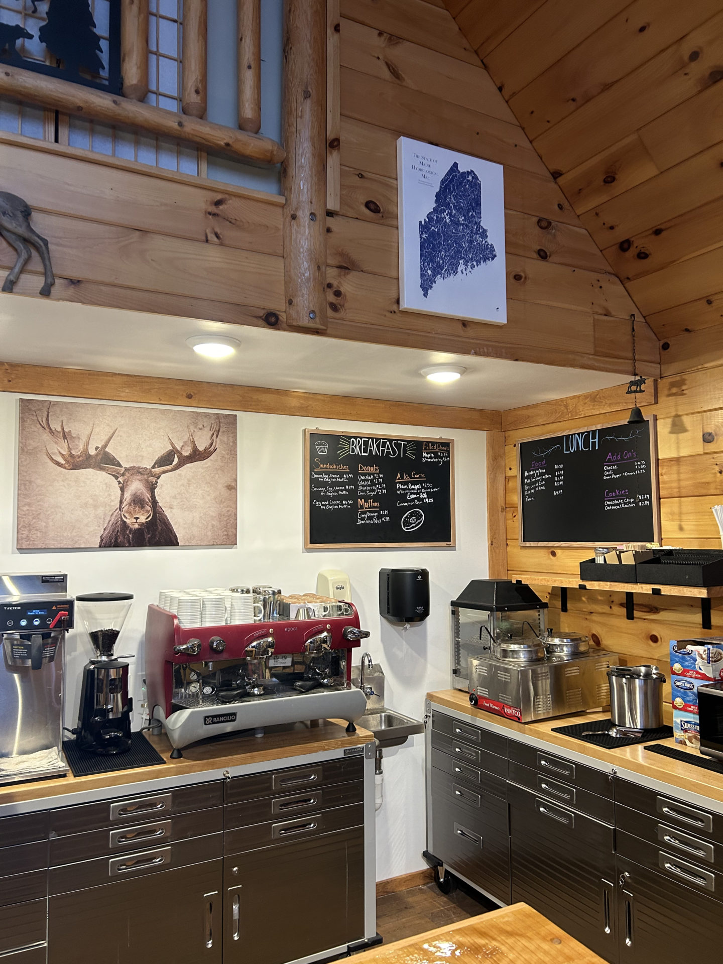Photo of River Roots Cafe espresso machine and coffee area 