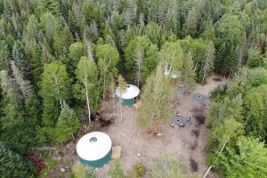 Aerial view of three of Northeast Whitewater's yurts