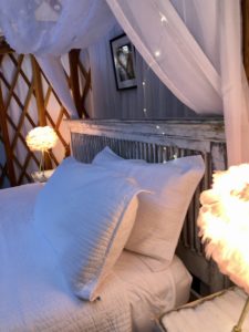 King bed yurt preview of bed, canopy, and lamps.