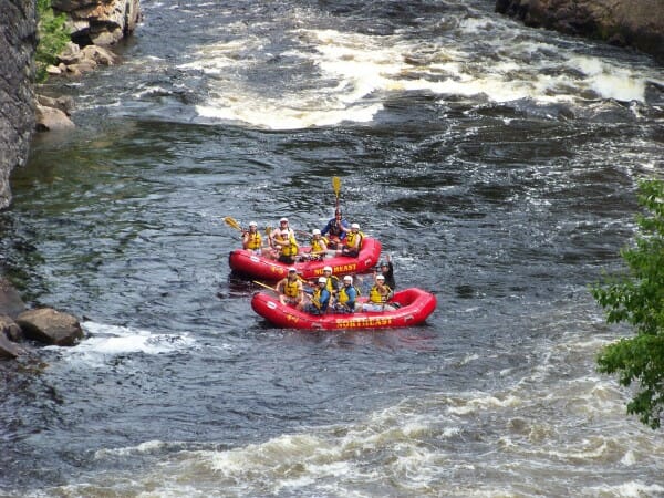 Two red rafts on the Penobscot River in Maine