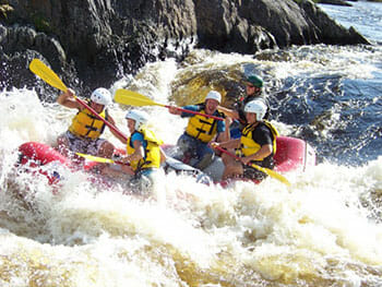 People Whitewater Rafting on the Seboomook River