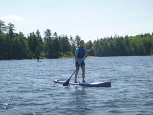 Person Paddle boarding in Maine 