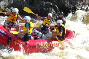 Group of five rafting on the Seboomook river in Maine with Northeast Whitewater